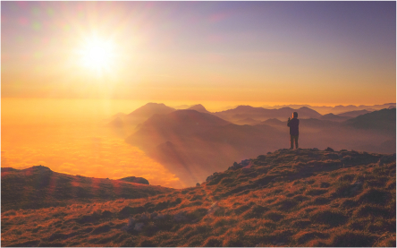 a sunrise over a mountain range